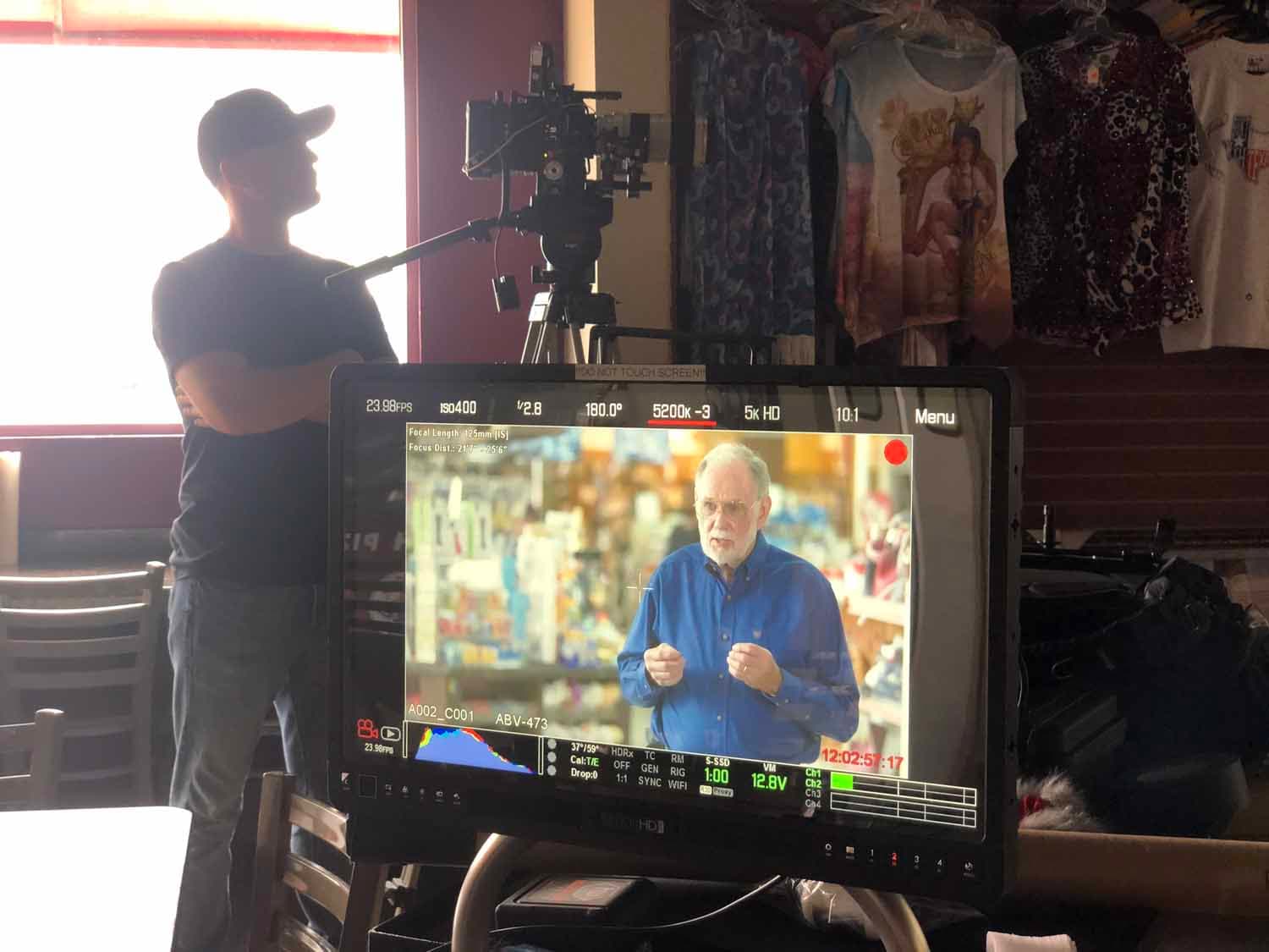 The director of photography sets up his interview shot on a corporate video shoot.